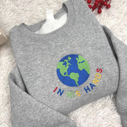 In His Hands Embroidered Sweatshirt, Christian Earth Design Shirt, Faith Based Gift for Her, God’s Love Embroidery, Spiritual Cozy Hoodie
