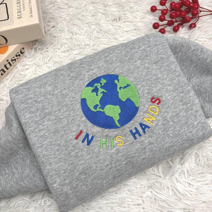 In His Hands Embroidered Sweatshirt, Christian Earth Design Shirt, Faith Based Gift for Her, God’s Love Embroidery, Spiritual Cozy Hoodie