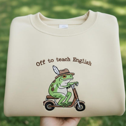 Off To Teach English Embroidered Shirt, Funny Frog Teacher Sweatshirt, Frog Riding Scooter Crewneck, English Teacher Gift Shirt