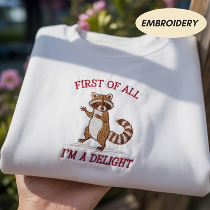 First Of All I'm A Delight Embroidered Sweatshirt, Funny Raccoon Shirt, Sarcastic Animal Apparel, Cute Raccoon Crewneck, Meme Sweater