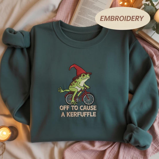 Off To Cause A Kerfuffle Embroidered Sweatshirt, Funny Frog Riding Bicycle Shirt, Cute Toad Cottagecore Apparel, Animal Crewneck Top