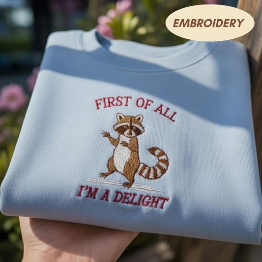 First Of All I'm A Delight Embroidered Sweatshirt, Funny Raccoon Shirt, Sarcastic Animal Apparel, Cute Raccoon Crewneck, Meme Sweater